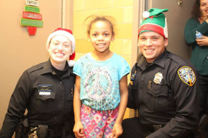 "The Cops with Hearts" as described by an Olneyville resident, delivering Christmas gifts to children in Olneyville.